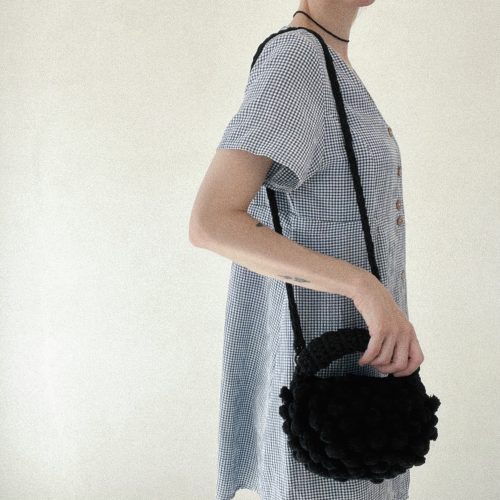 ¨Half Moon” pom pom crochet handbag with crossbody strap black